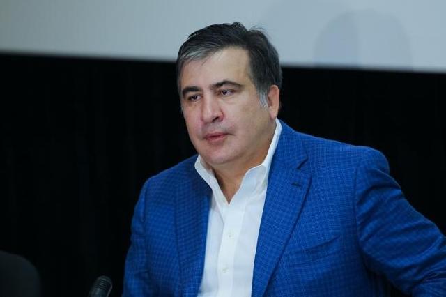 Saakaşvilinin fotosu fonunda "Mən qayıdacağam" yazıldı
